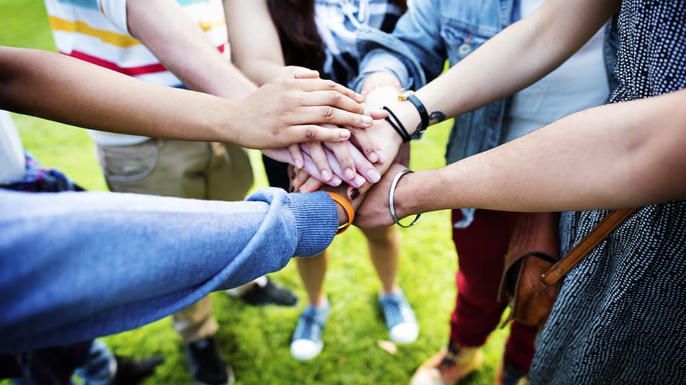 Hands joined together in a circle